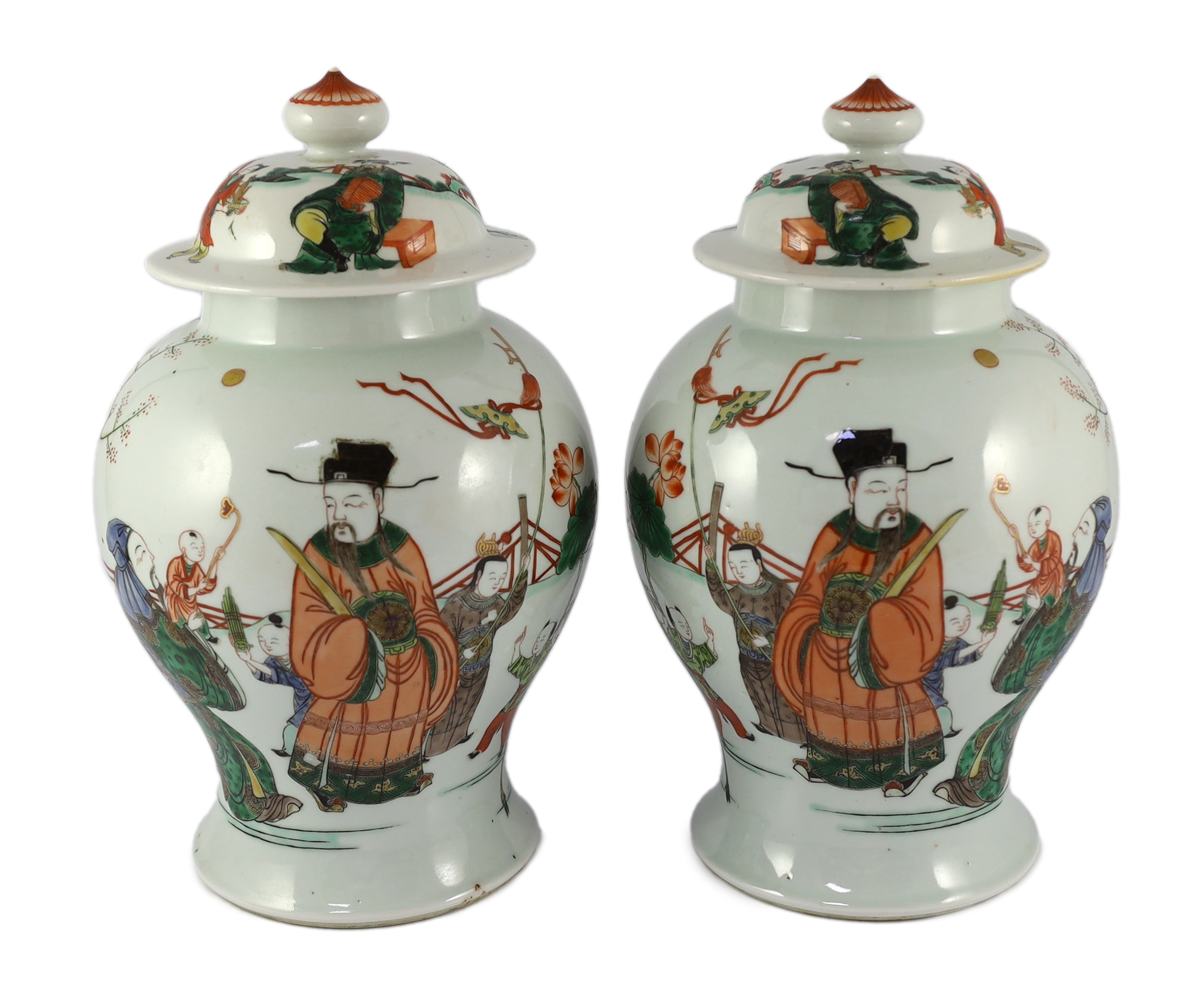 A pair of Chinese famille verte ‘Sanxing’ vases and covers, 19th century, some cracks